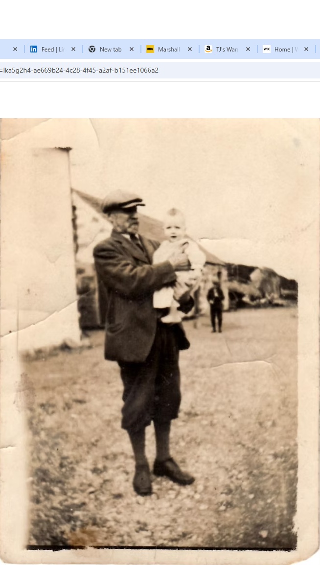 TJ as a baby with Grandpa John